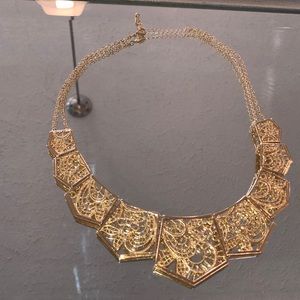 Gold statement necklace.